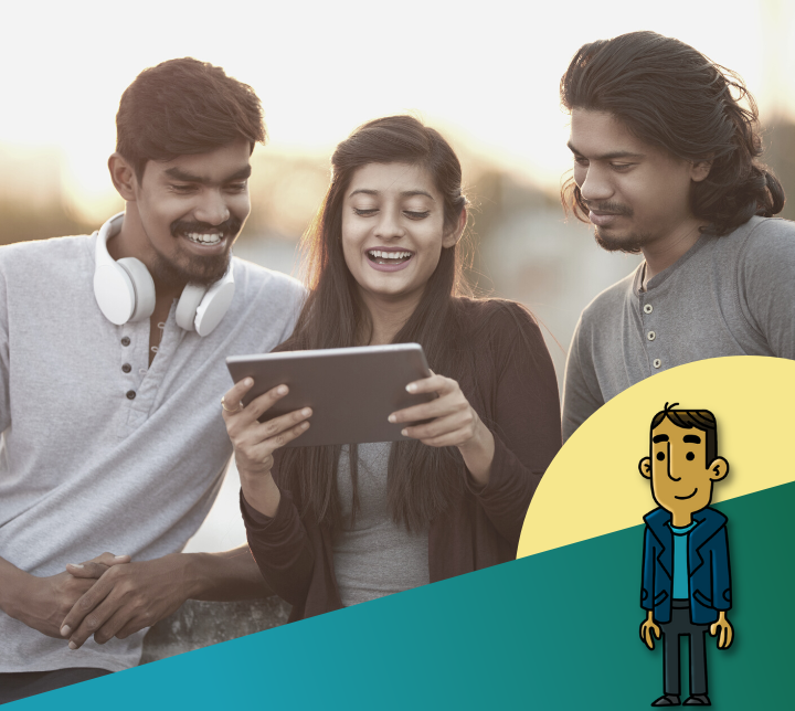 Three young Indians looking at a tablet